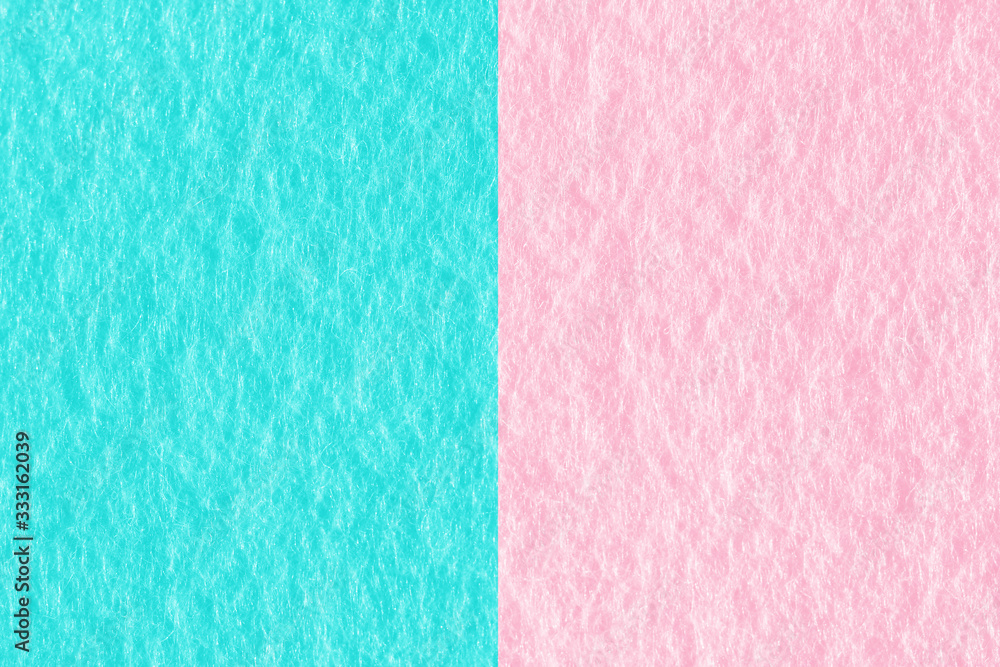 Abstract pink and blue color felt fabric textured background with copy space for design and decoration. Two tone background fashionable glamorous divided into two parts.