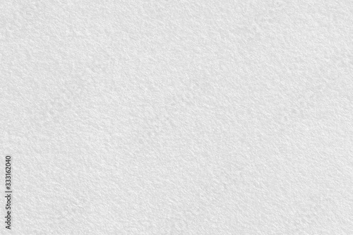 White felt background. Surface of fabric texture in cream color.