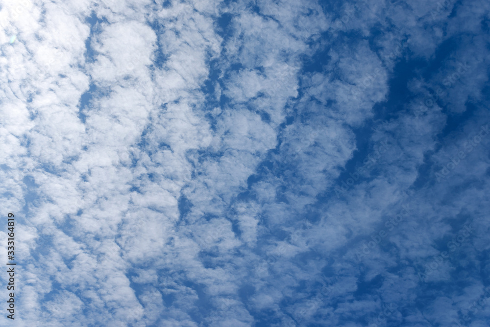 Clouds illuminated by the sun against a blue sky. Clouds illuminated by the sun against a blue sky.
