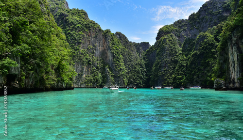 Breathtaking landscape in Koh Phi Phi with clear water and high limestone cliffs in great weather © David