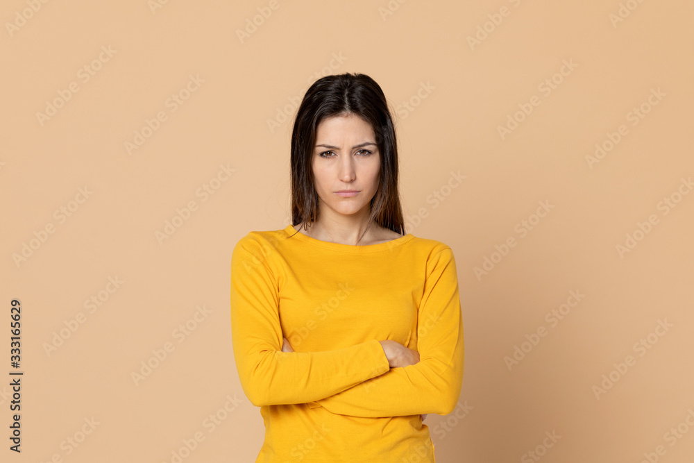 Attractive young girl wearing a yellow T-shirt