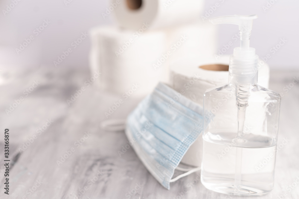 Sanitizer, hand sanitizer, against coronavirus. Medical and toilet paper mask. Coronavirus, and cleanliness. Sanitizer, hand sanitizer, against coronavirus. Medical and toilet paper mask. Coronavirus, and cleanliness.