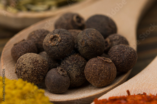 Peppercorns from a Black Pepper Plant (Piper nigrum) close up . Spice background