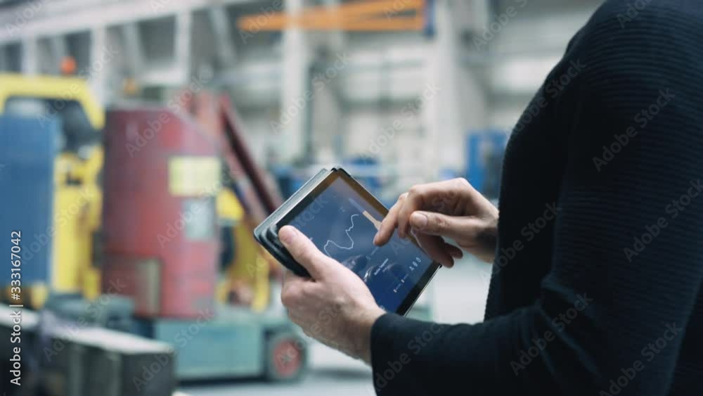 IOT Engineer using internet of things app in company