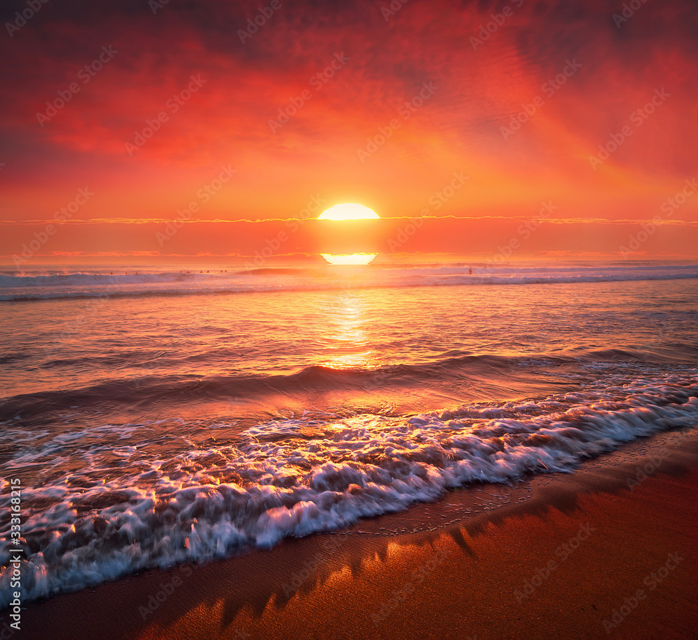 Wallpaper murals beautiful red sunset on beach with big sun