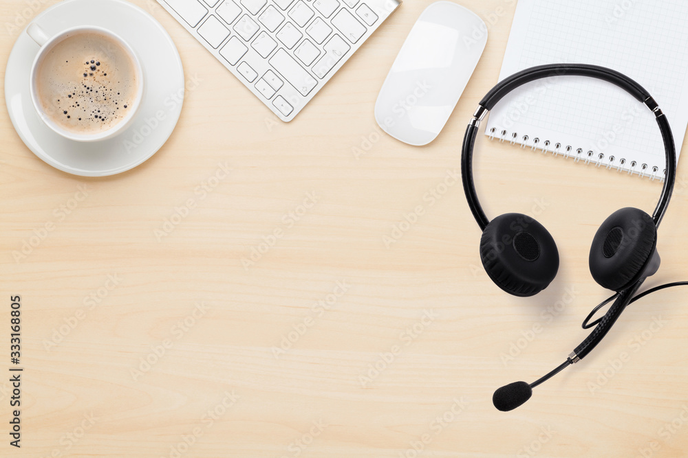 Office wooden backdrop with supplies and headset Office wooden backdrop with supplies and headset