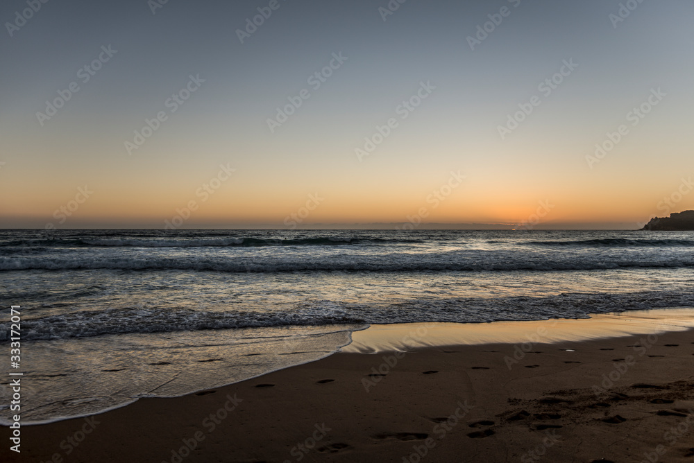 empty surfing beach at sunrise
