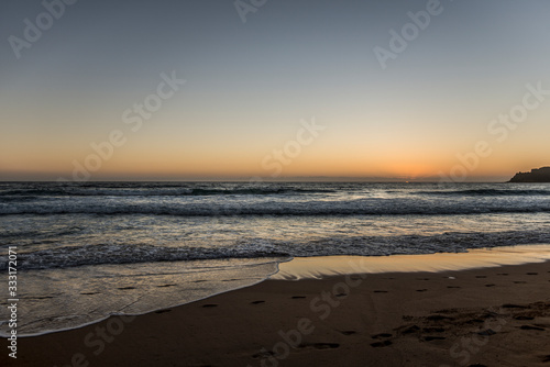 empty surfing beach at sunrise