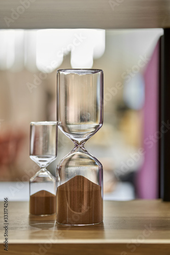 Closeup view at hourglasses with brown sand