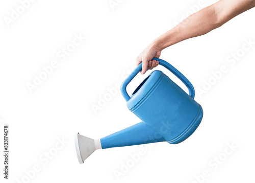 Fototapeta Hand holding a blue watering can, Isolated on white background with clipping path