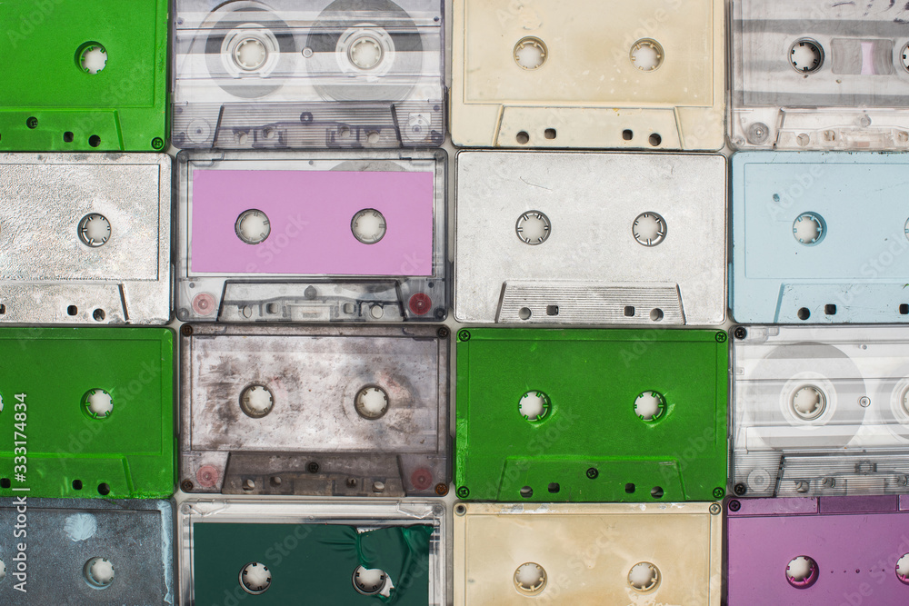 collage of purple, green, turquoise and white old recording cassettes collage of purple, green, turquoise and white old recording cassettes