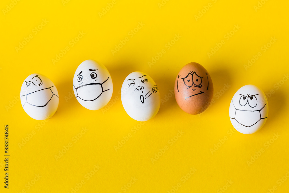 drawing faces on eggs isolated on yellow background