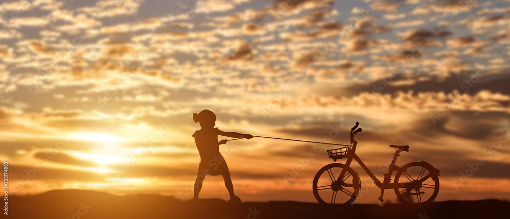 Fototapeta premium Silhouette of girl pulling bike at sunset background