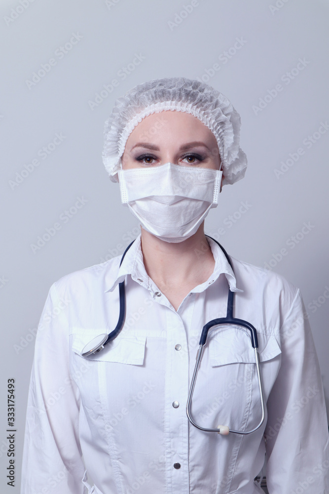 Female doctor in a protective medical mask. Pandemic virus COVID-19 Female doctor in a protective medical mask. Pandemic virus COVID-19