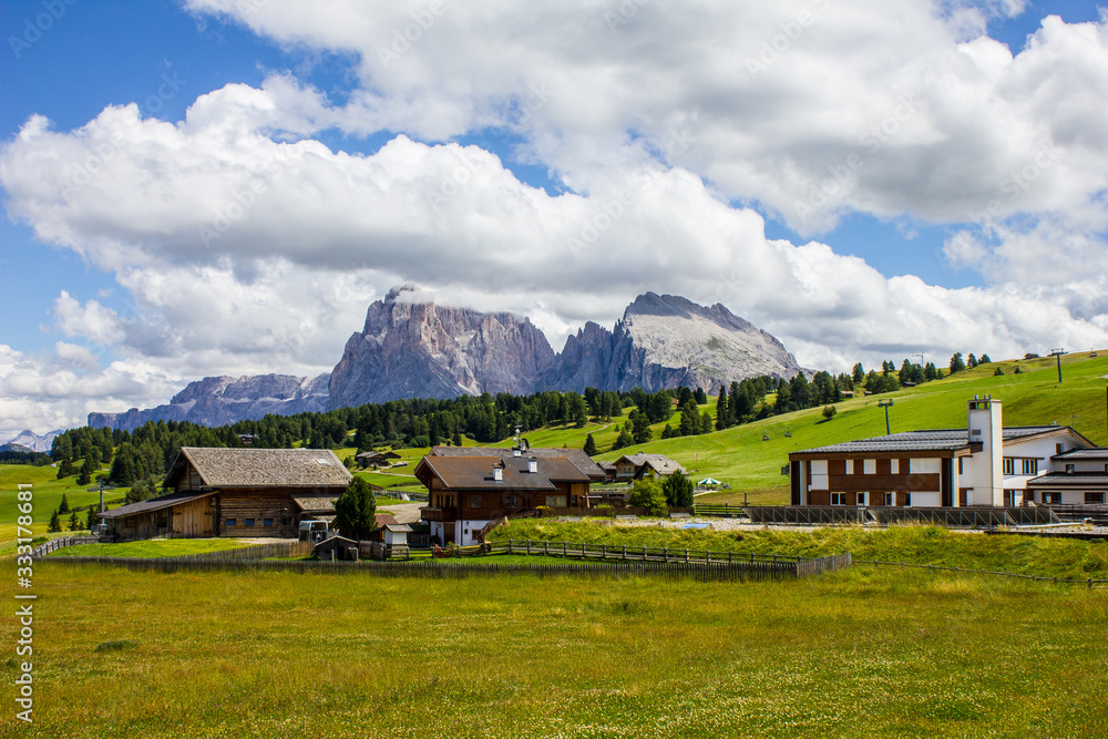Compatsch Houses with Langkofel and Sella Group Mountains in the Background