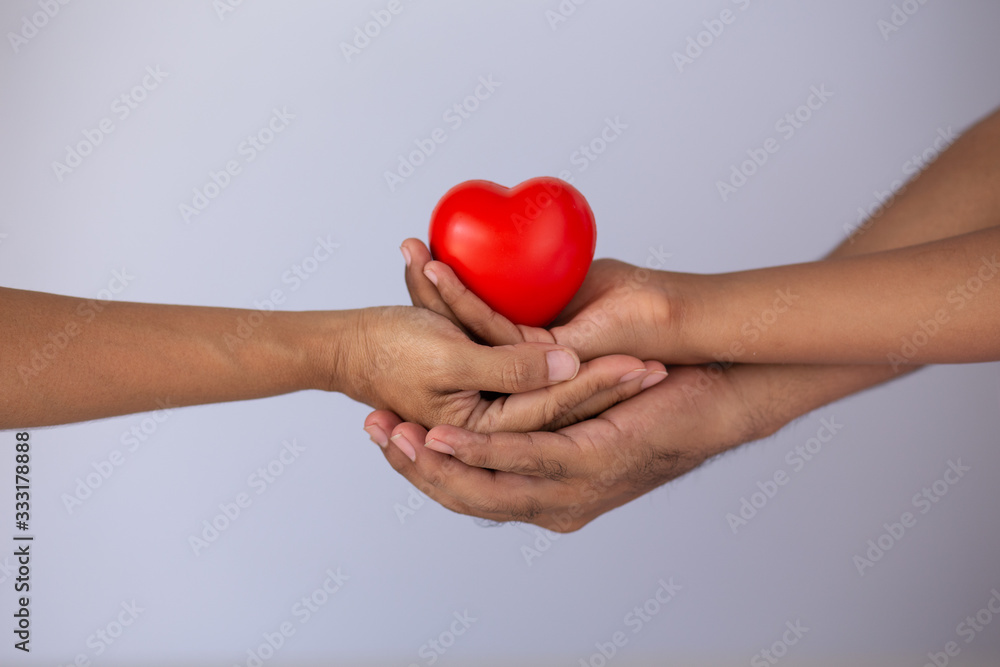 Obraz premium family holding heart red symbol valentine romantic emotion happy, concept: virus covid 19 biological protective Epidemic virus, donate charity organ for health, compassion responsibility for health