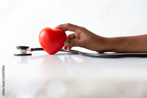 Fototapeta Naklejka Na Ścianę i Meble -  Hands young holding heart symbol couple happy love valentine day romantic background  isolated, concept: donate charity organ for health, check disease healthy hypertension and atherosclerosis damage