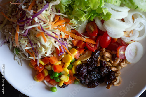 Vegetable salad in a bowl on the table  Cuisine home top view, Healthy Food Fresh mixed nutritiously for female super easy vegetarian meal delicious to health Low-calorie salad natural organic photo