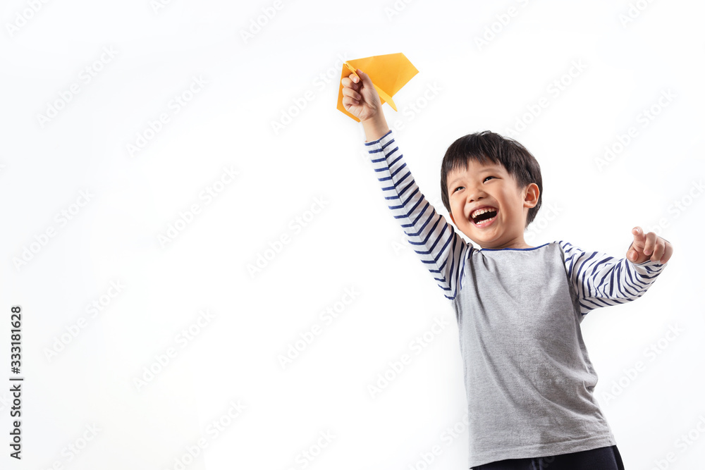 Boy holding paper airplane isolated on white background