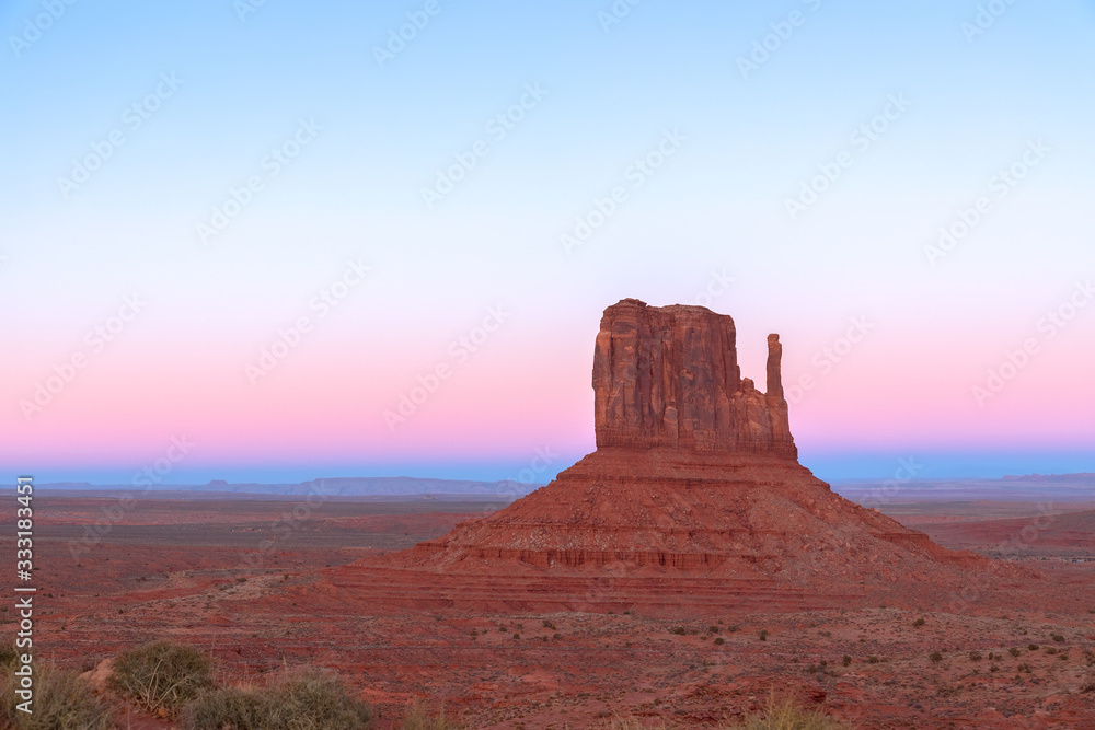 Beautiful sunset over famous Butte of Monument Valley on the border between Arizona and Utah, USA
