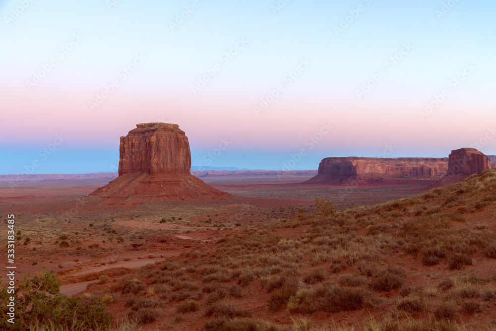 Beautiful panoramic sunset view over famous Buttes of Monument Valley on the border between Arizona and Utah, USA