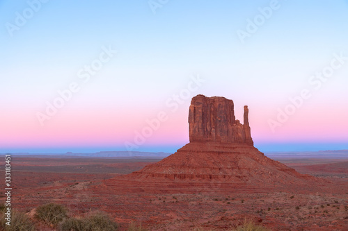 Beautiful sunset over famous Butte of Monument Valley on the border between Arizona and Utah  USA