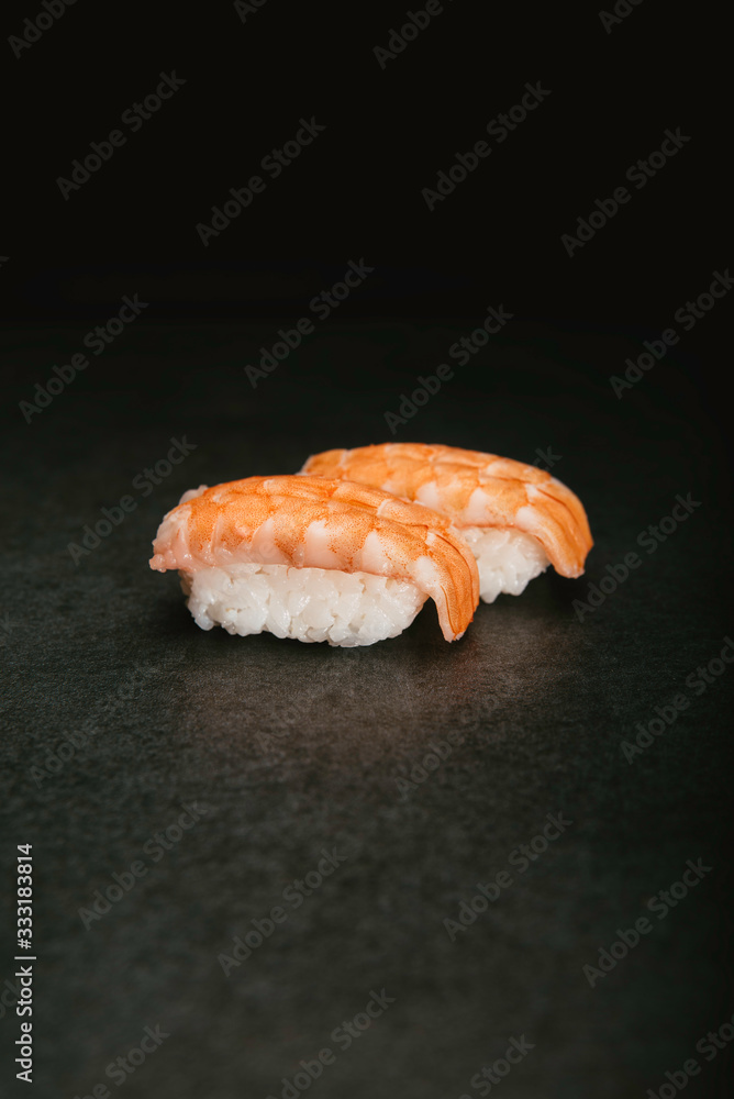 Stock photo of prawn nigiri sushi on black background. Stock photo of prawn nigiri sushi on black background.