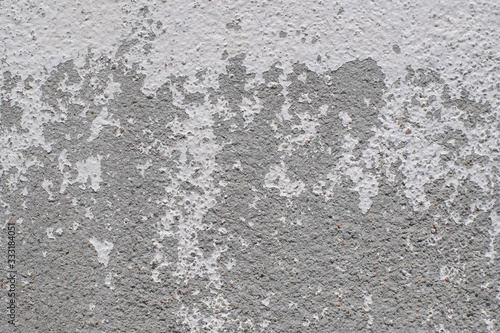 White paint surface texture of the cement wall that peels off close-up background.