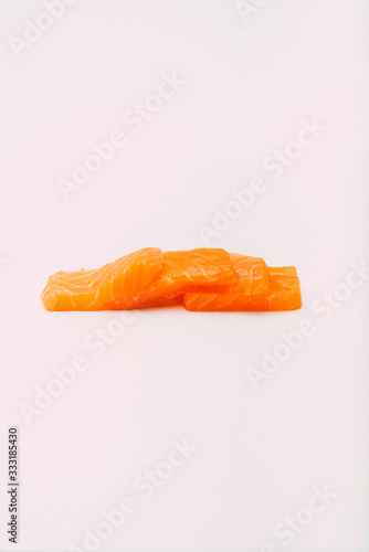 Stock photography of sashimi stacked on white background.