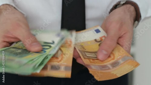 Wallpaper Mural Man Counting Money. Close up of female hands counting 50 and 100 euro banknotes. Euro currency exchange. Cash money calculation. Torontodigital.ca
