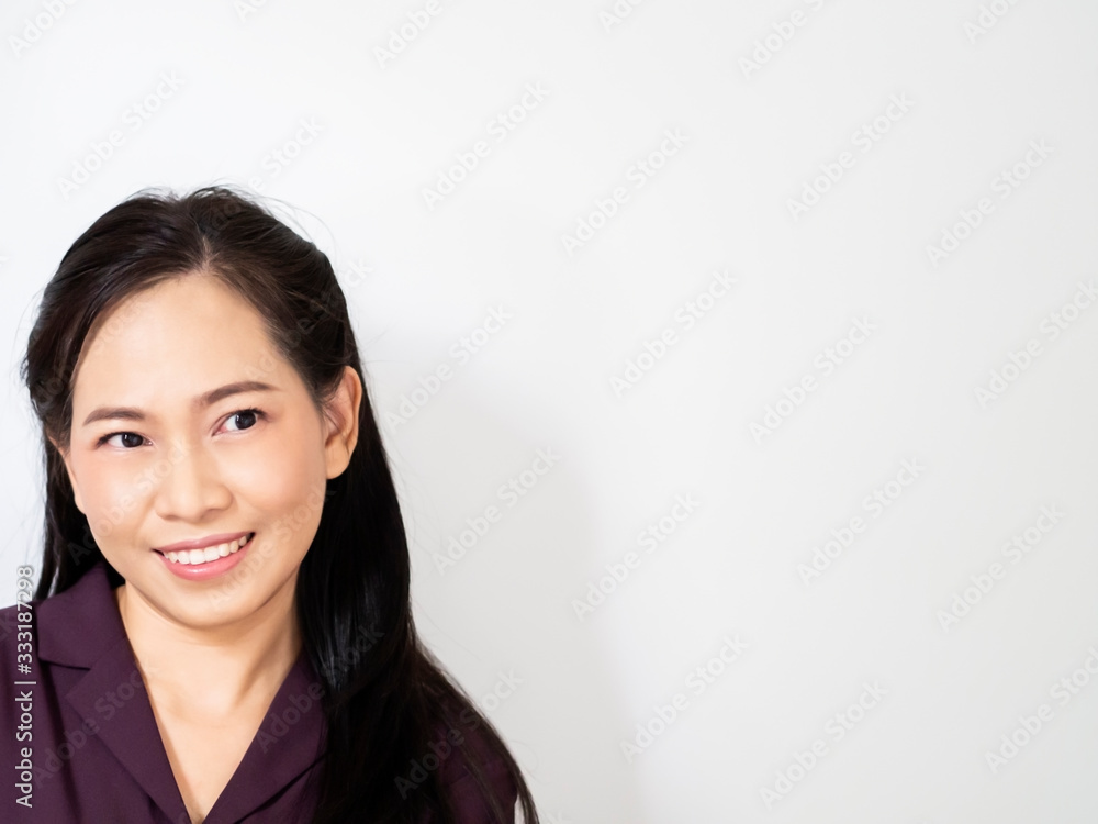 One happy and confidence asian bussiness woman has dark brown long hair and wear violet shirt. She is smilling and acting emotion look at space. Copy space for wording white background. Service mind. One happy and confidence asian bussiness woman has dark brown long hair and wear violet shirt. She is smilling and acting emotion look at space. Copy space for wording white background. Service mind.
