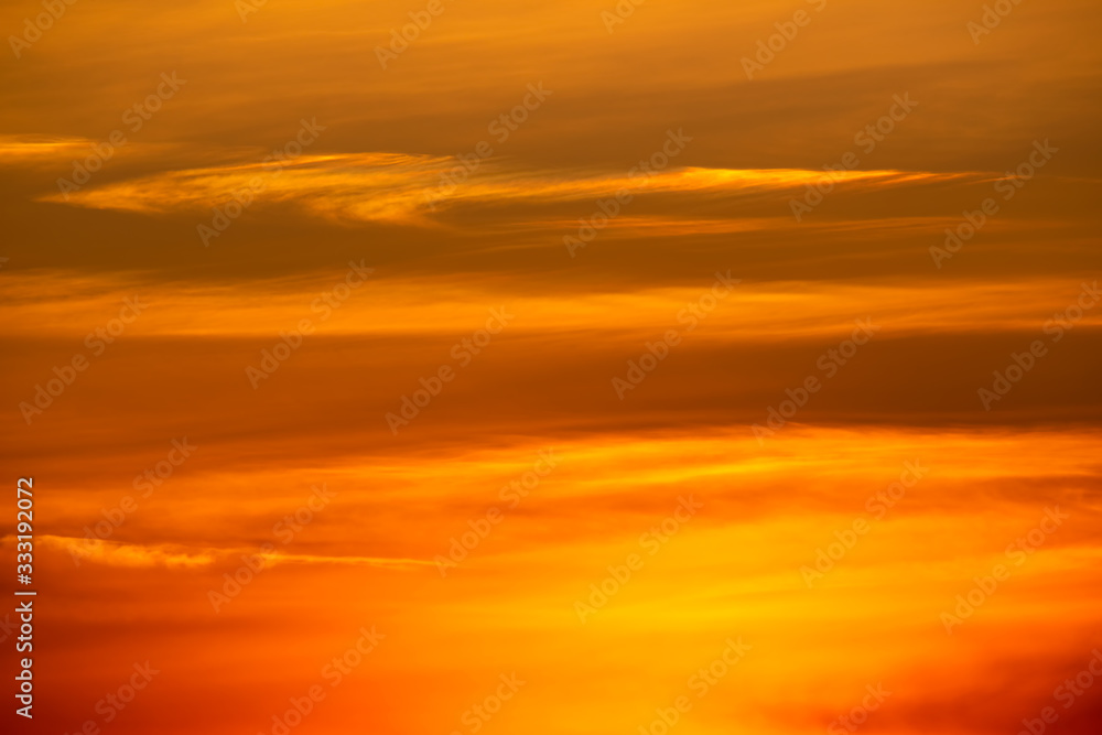 Beautiful golden sunset sky with clouds