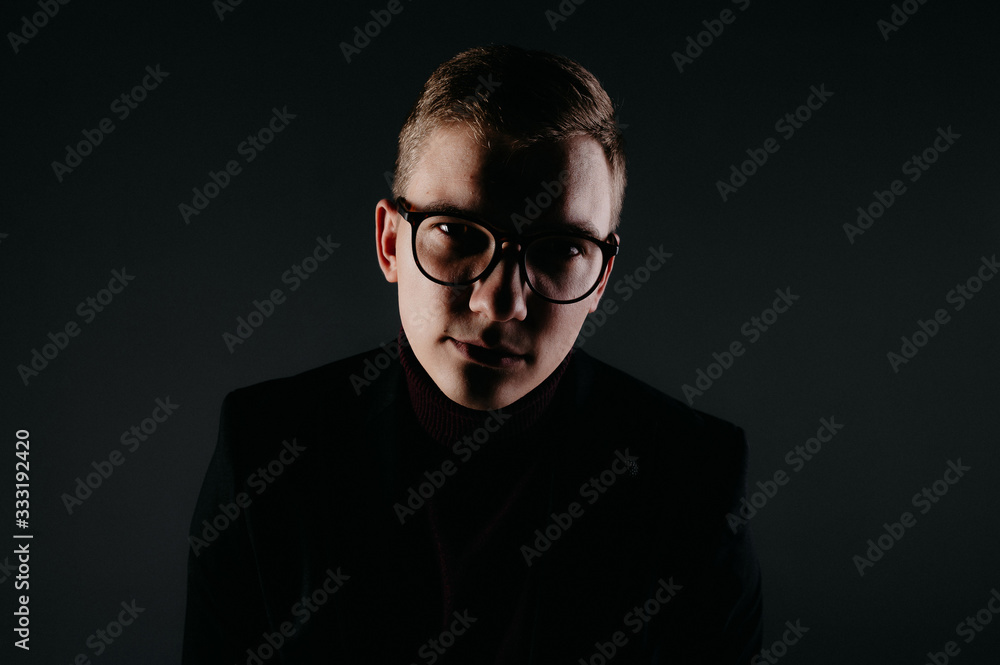 A young male journalist with glasses. A young male journalist with glasses.