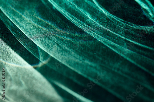 abstract light glow, lens flare, caustics water glas reflections. light through a prism, green. black background