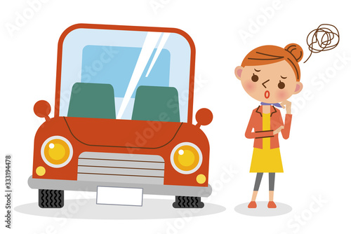 パンクした車と困っている女性ドライバー