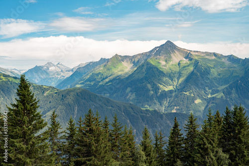 Panoramic view of the famous mountain peaks glowing in the beautiful golden sunlight in summer, Zillertal Austria. In the background the Great Venetian