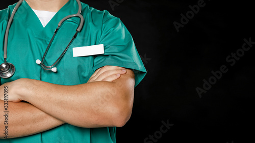 Male doctor with crossed arms