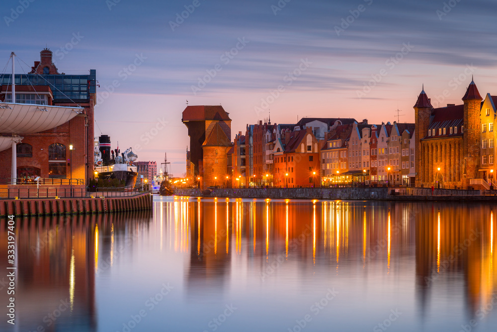 Obraz premium Gdansk with beautiful old town over Motlawa river at sunset, Poland.