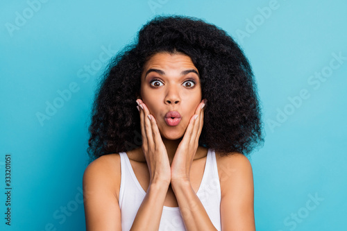 Close-up portrait of her she nice attractive lovely winsome pretty cute amazed cheerful girlish wavy-haired girl new novelty reaction isolated over bright vivid shine vibrant blue color background © deagreez