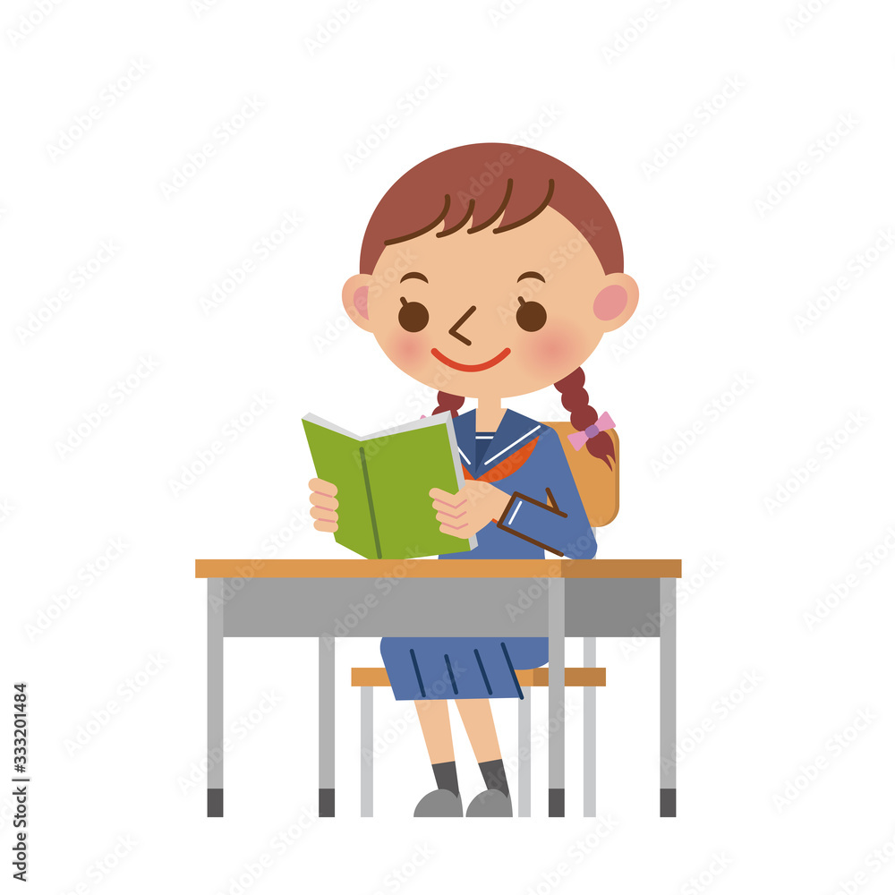 教室の机で本を読む女子中学生・高校生