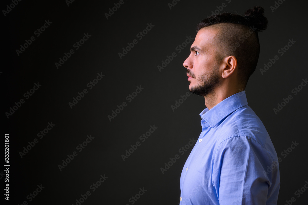Closeup profile view of handsome bearded Turkish businessman Closeup profile view of handsome bearded Turkish businessman