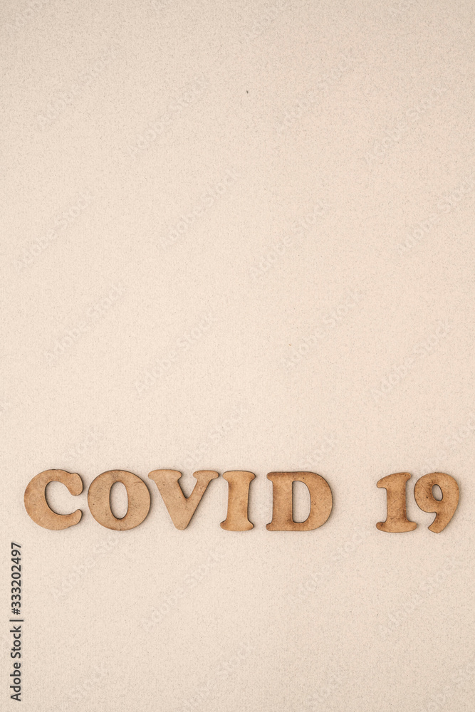 Epidemic corona virus covid 19 written with wooden letters Epidemic corona virus covid 19 written with wooden letters