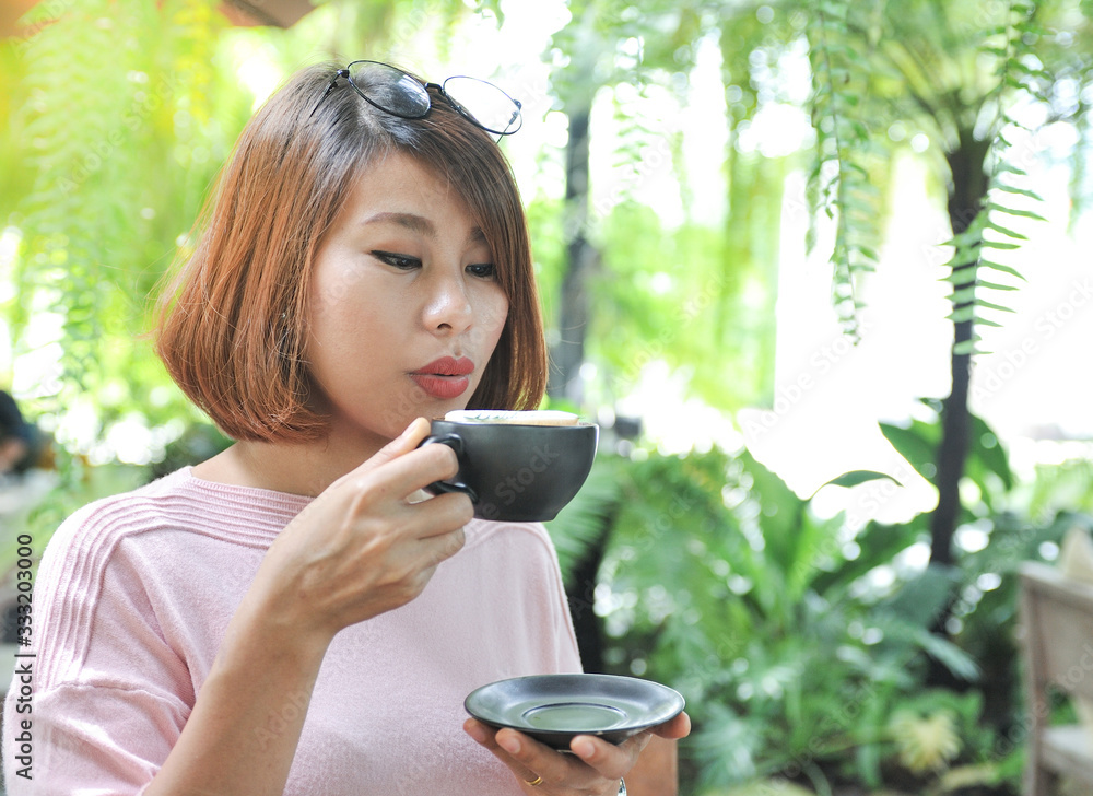custom made wallpaper toronto digitalAsian women enjoy drinking coffee in the garden,selective focus