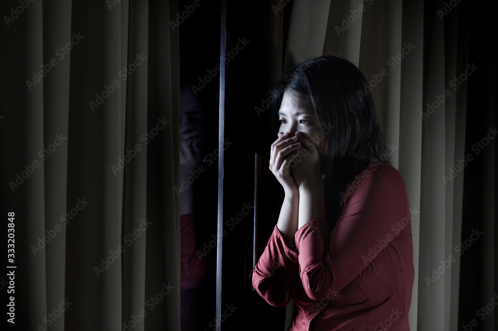 young beautiful scared and depressed Asian Chinese woman feeling overwhelmed and in panic lockdown alone at home during covid-19 virus outbreak quarantine young beautiful scared and depressed Asian Chinese woman feeling overwhelmed and in panic lockdown alone at home during covid-19 virus outbreak quarantine