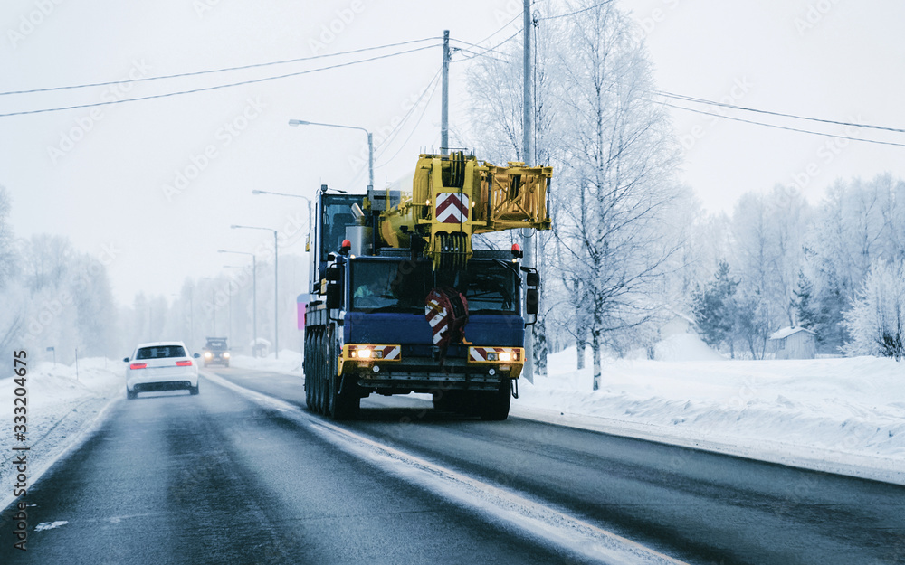 Truck in the Snowy winter Road of Finland Lapland reflex