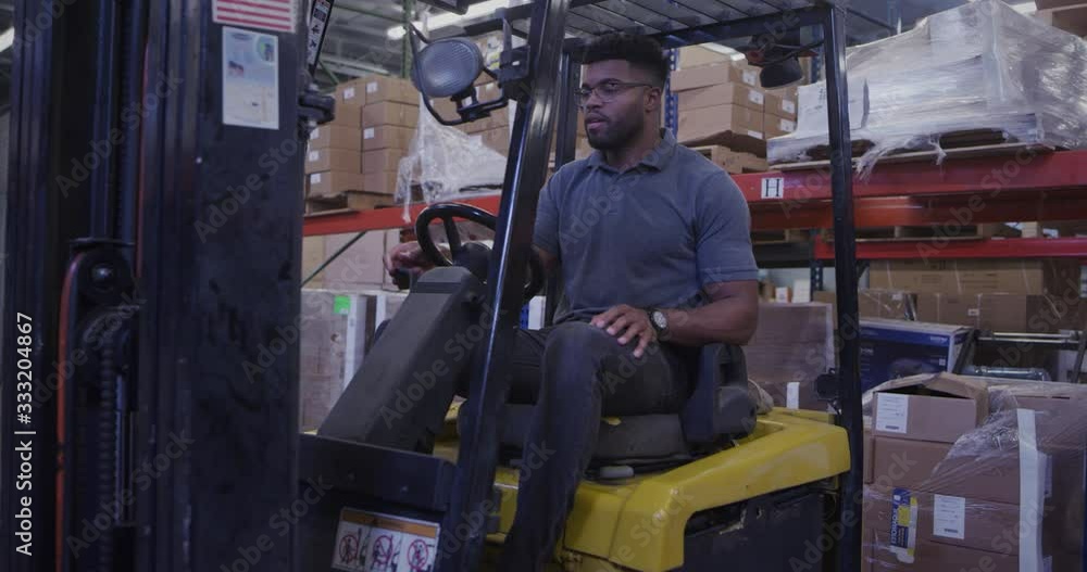 Manager in shipping warehouse using forklift Manager in shipping warehouse using forklift