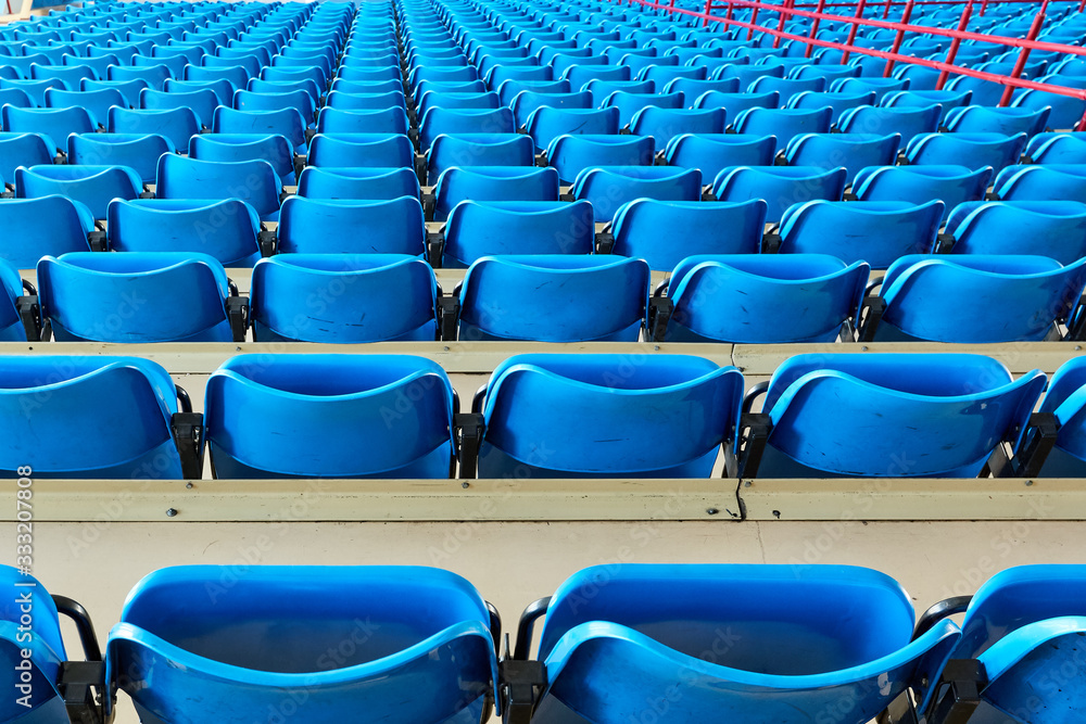 Fototapeta premium empty bleachers and chairs in blue