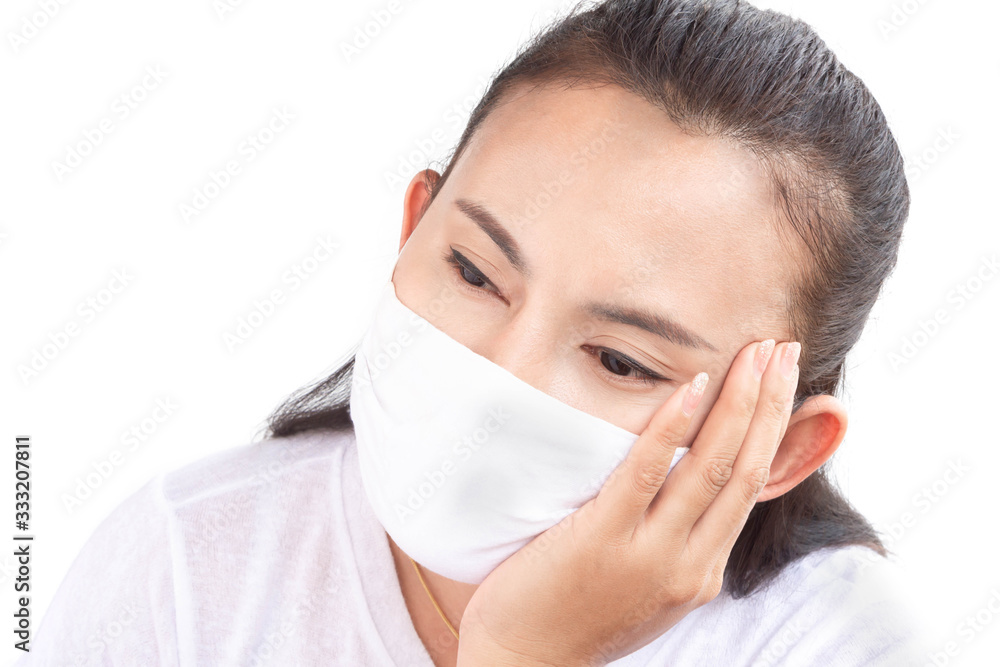 Closeup woman wearing face mask for protect air polution with white background, health care and medical concept Closeup woman wearing face mask for protect air polution with white background, health care and medical concept