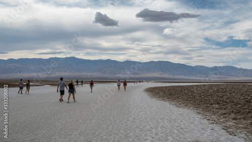 tourist people strolling at badwater basin in the death valley desert
