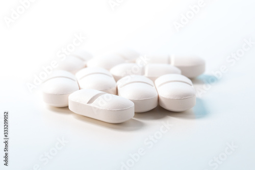 Group of painkiller tablets on white